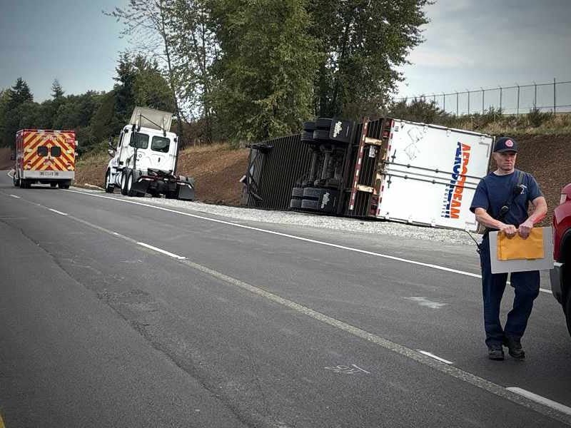 Semi rollover shuts down SR 509, triggers hazmat response Wednesday morning